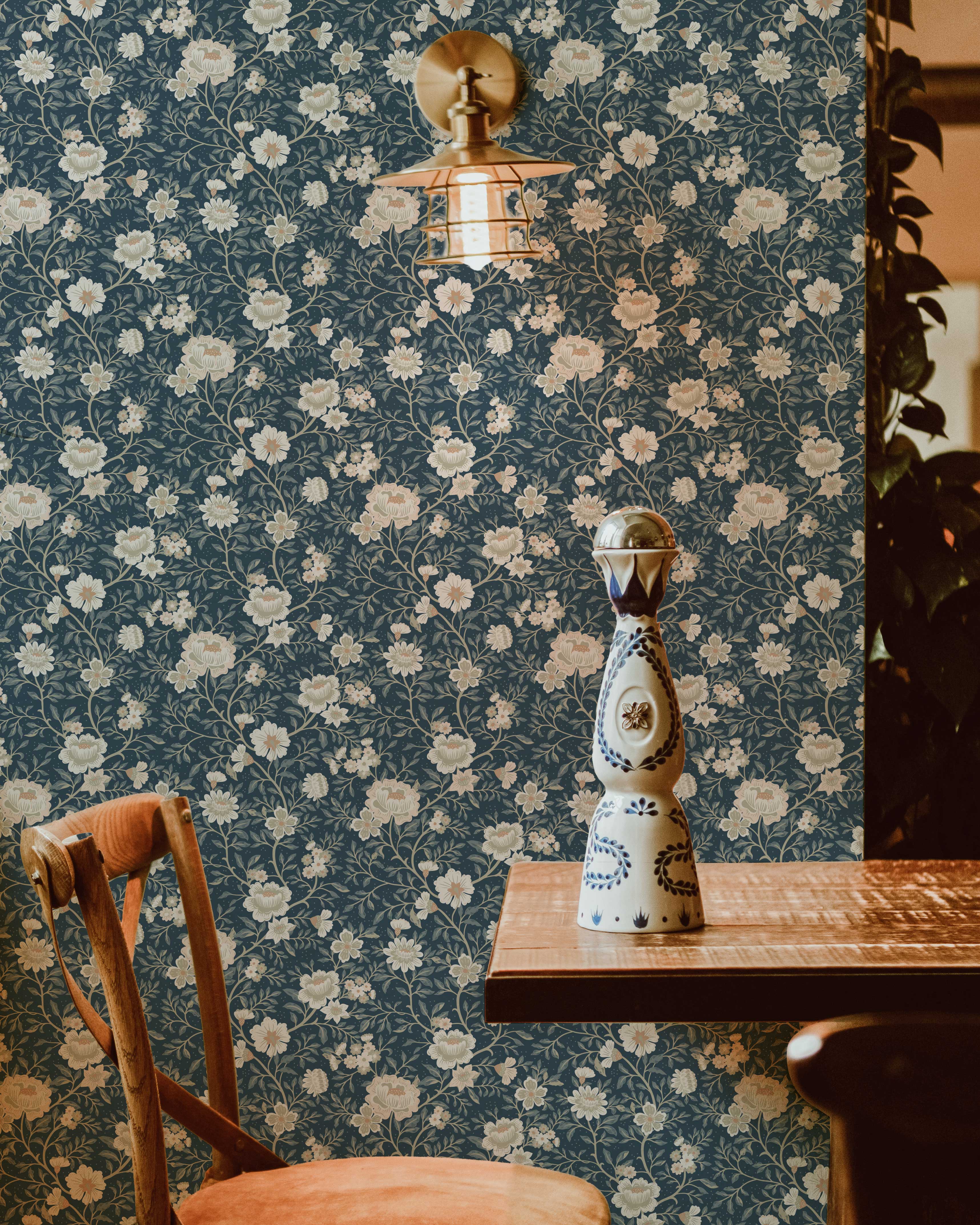 Floral wallpaper with a decorative vase on a table