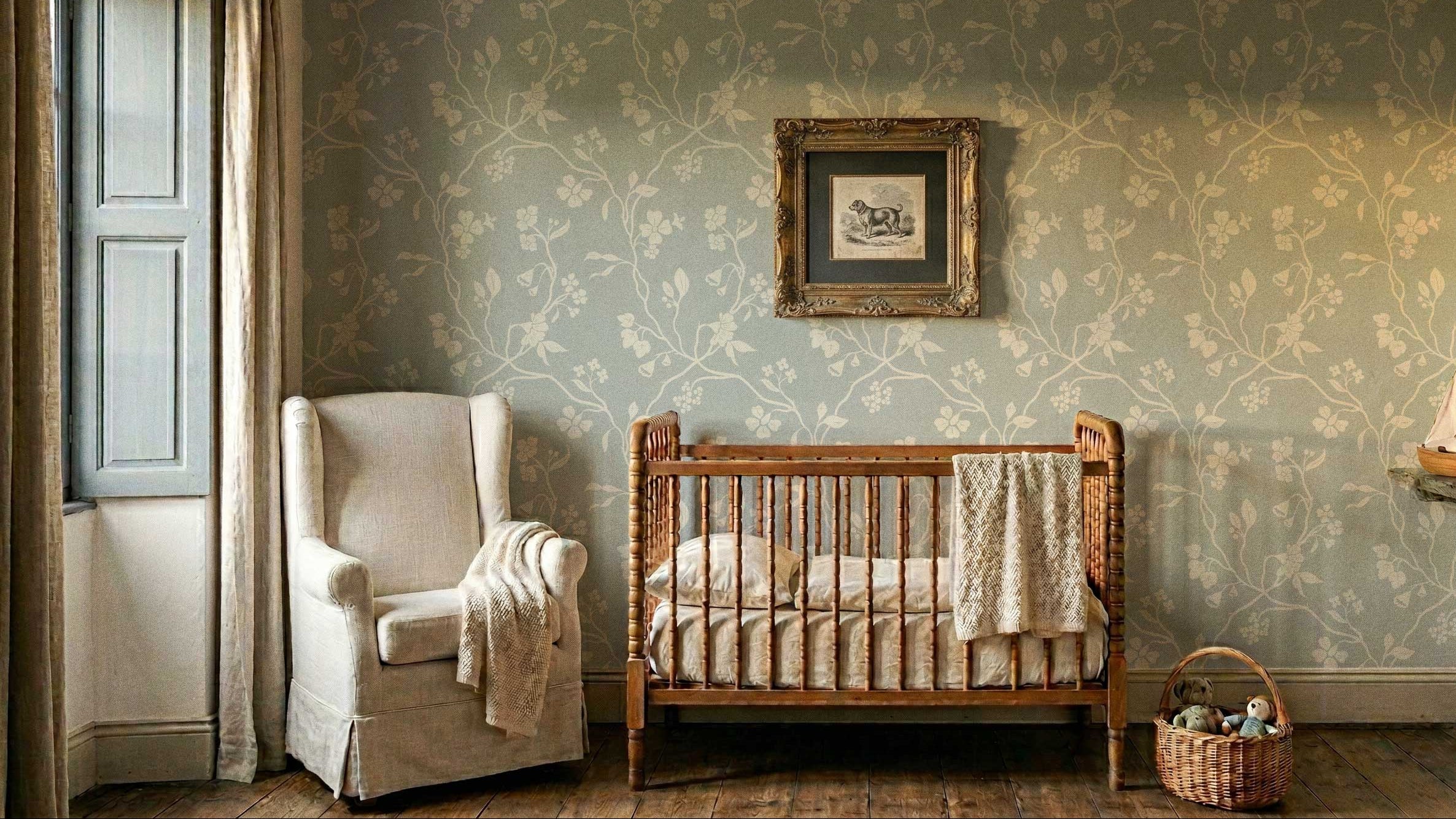 Nursery room with wooden crib, armchair, and decorative elements.